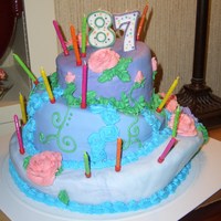 87 Topsy Turvy This was my first attempt at a topsy turvy cake and my first attempt at covering with fondant and my first time making buttercream roses. I...
