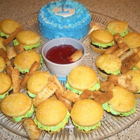 Hamburger And Fries Inspired by CC, white cupcakes with a brownie in the center held together with vanilla buttercream that looks like lettuce and mustard. The...