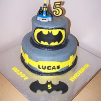 Batman!! double 10 and double 6 white cake with chocolate filling....vanilla cream icing and fondant accents.....topped with a molded candy 5 and a...