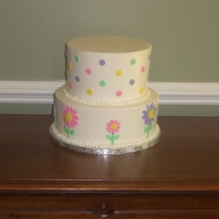 Polka Dot Daisy Cake Baby shower cake with carrot cake on top, red velvet on bottom with all BC and MMF accents. I added a pink baby stroller out of gumpaste...