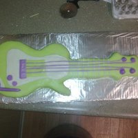 Guitar Cake This was my second cake i ever made and it was for my nephew. I hand carved the guitar out and used no stencil things or anything. It was...