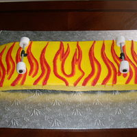 Skateboard carved skateboard cake, hand piped the fire all buttercream, no fondant