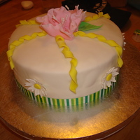 Course 4 Final Cake I covered the cake in white MMF. It has a real ribbon border and topped with a Wilton Fantasy Flower made of gumpaste. I also added...