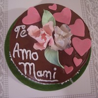 Mother's Day round cake chocolate with chocolate buttercream, and gumpaste flowers and fondant hearts, specially for my mom even if she is many...
