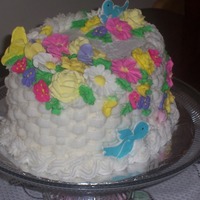 Mi Primera Canasta Primavera oval chocolate cake, cover with buttercream, and flowers of royal icing I really enjoy do this!!!