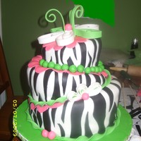 Zebra Stripes Girlie This is a cake i did for a friends 18th birthday.. She loved it!! Zebra stripes out of fondant and the green swirls out of fondant/gum...