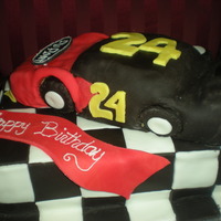 Jeff Gordon Birthday Cake Double chocolate fudge cake with chocolate buttercream and fondant. Car is RKT covered in bc and fondant. tyfl