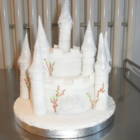 Enchanted Winter Castle This is a 5" fand 2" fruit cake covered with marzipan and sugarpaste. The turrets are made from Flowerpaste and sugarpaste and...