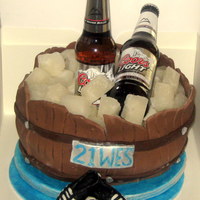 Beer Barrel Cake Chocolate devil cake covered in fondant. Ice cubes made from sugar water set in ice cube trays, turned out really real looking - didnt know...