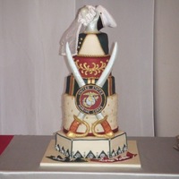 Marine/nurse Wedding Marshmallow fondant, airbrush work, anchor/globe/eagle symbol on crossed sword piece is hand cut and hand painted fondant. Fondant ribbons...