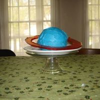 Saturn Devils food cake baked in a cake pan. The ring is made out of Karo syrup, sugar and water melted together and I made a mold for it. This...