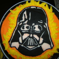 Darth Vader B-Day Cake This was a chocolate cake with cherry filling for my dad. The Darth vader is a FBCT, all the rest is buttercream as well. 8" round.
