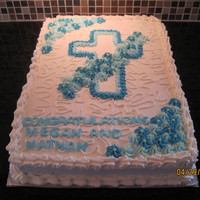 First Communion I made this cake for my friends children. It's 1/2 chocolate and 1/2 yellow, covered in vanilla buttercream. The cross and flowers are...