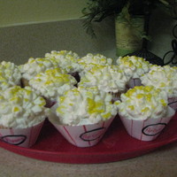 Popcorn Cupcakes Yellow cupcakes with bc icing and mini marshmallows cut with an x on top to look like popcorn using scissors. The butter topping effect was...