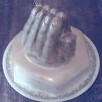 Prayers At Christmas A white angel food caked with whipped cream filing and covered in fondant. The hands are a Devils Food Chocolate with a Ganache filling,...