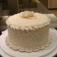 My First Event Cake Hazelnut cake with chocolate hazelnut mousse, and hazelnut buttercream. Decorated with #2 tip sotas, star tip borders and edged with leaves...