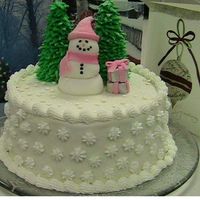 Snowman Cake Chocolate and Butter Yellow checkerboard cake with buttercream icing, fondant snowman and gifts, ice cream cone trees. This cake was a lot...