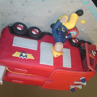 Fireman Sam Fireman Sam cake, I made this with an open cab front. All completely edible & handmade.