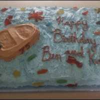 Boat Ride It's a 1/2 and 1/2 cake with the boat made out of cake as well. I was asked to make a cake for two kids for their birthday. They were...