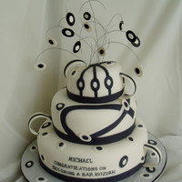 Bar Mitzvah This cake was made to match special designed table linen and art theme.Fondant covered and artwork of sugarpaste and fondant.