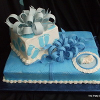 Baby Boy Shower stacked packages in buttercream, sugarpaste bow and baby.