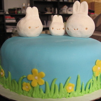 First Easter Cake This is my first easter cake. the top bunnies are made out of rice krispy treats and gum paste. I will never use gum paste again, but i was...