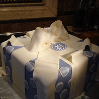 Polka Dot Package Cake Chocolate devils food cake with chocolate whipped ganache filling. Used airbrush to give the pearl sheen.