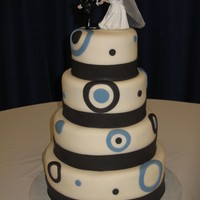 Black And Country Blue 12" choc. 10" yellow, 8" choc., 6" yellow covered with BC and fondant