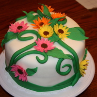 Labor Day Cake Two layer butter yellow cake covered in white fondant with fondant/gumpaste flower accents. TFL!