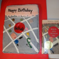 1St Book Cake The cake is covered in buttercream with the building and details on the front made from fondant.