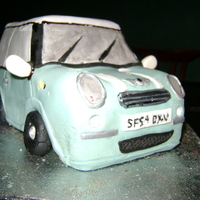 Mini Cooper I helped a friend make a mini cooper car for her dad's birthday.Made from Planet Cake's mudcake recipe, ganache then fondant....
