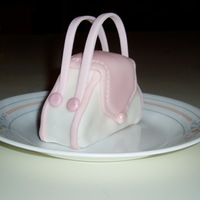 Mini Purse Cake First time trying to make a mini purse cake for bridal shower. This cake is about the size of a small cupcake. I used pound cake and...