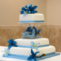 Square Wedding Cake With Glass Cube Separator And Blue Tiger Lillies 