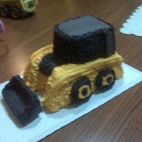 Skidloader Cake My son LOVES construction equipment, especially skidloaders, so for his birthday I decided to give it a try. I didn't find much online...