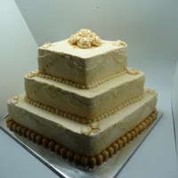 Gold And Lace Engagment Cake i made this for my brothers engagment party.. bottom and top layers are vanilla with custard filling and middle layer is chocolate with...
