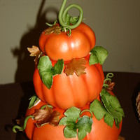 Pumpkin Cake My son wanted a three tier pumpkin cake for his 6th birthday. This is a red velvet cake covered in MMF and all decorations are MMF. Used an...