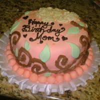 Moms Birthday Moms birthday cake. Done in peach colored fondant with icing vines and a peony flower on top.
