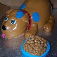 Tiago's Puppy This was for a one-year-old's first birthday. Chocholate cake with chocolate espresso ganache filling. The food dish was his smash...
