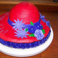 Red Hat Cake A birthday cake for a Red-hatter. Gum paste flowers and bow with buttercream icing.