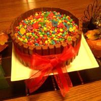 Kit Kat Cake I made this for my husband's birthday...his two favorite candies are Kit Kats and m&ms :) He liked it!