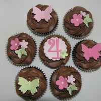 Butterflies And Blossoms Chocolate cupcakes with chocolate buttercream.