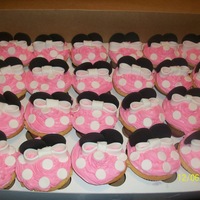 Minnie Mouse Cupcakes!! Vanilla and Strawberry swirled cupcakes decorated with buttercream and fondant accents. The birthday party theme was Minnie Mouse...it...