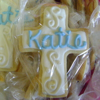 Cross Cookies I made these for my friends daughters communion. Her favorite color is blue so that's why her name is in blue. :)