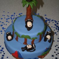 Monkey Island Made for a baby shower. Fondant covered white cake. Monkeys, tree, and decorations made from fondant.