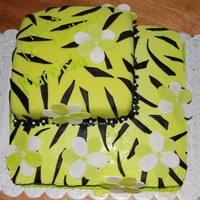 My Friends Daughters 12Th Birthday Cake!! top is chocolate cake covered in fondant. the bottom is french vanilla cake with vanilla frosting. the flowers are gumpaste and the stripes...