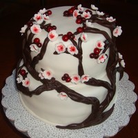 Berries And Flowers Dark brown trunk, dark red berries and/or flowers with a cherry tree look... was the request for this cake. 8" chocolate w/chocolate...