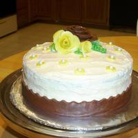 Beginner Cake Red Velvet cake with buttercream icing. Fondant rose and fondant ribbon border