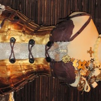 Steampunk Bustier & Corsage Taking cues from a Victorian corset, I added a steampunk feel to the "boning" which is now riveted together. The corsage is...