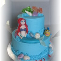 The Little Mermaid White cake with fresh strawberries and french vanilla buttercream frosting. Ariel and flounder were made from fondant....and boy do I need...