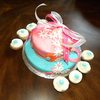 Daisy Color Cake Butter cake with buttercream icing layers, covered in fondant and daisy gum paste flowers. Cupcakes used for accent color!